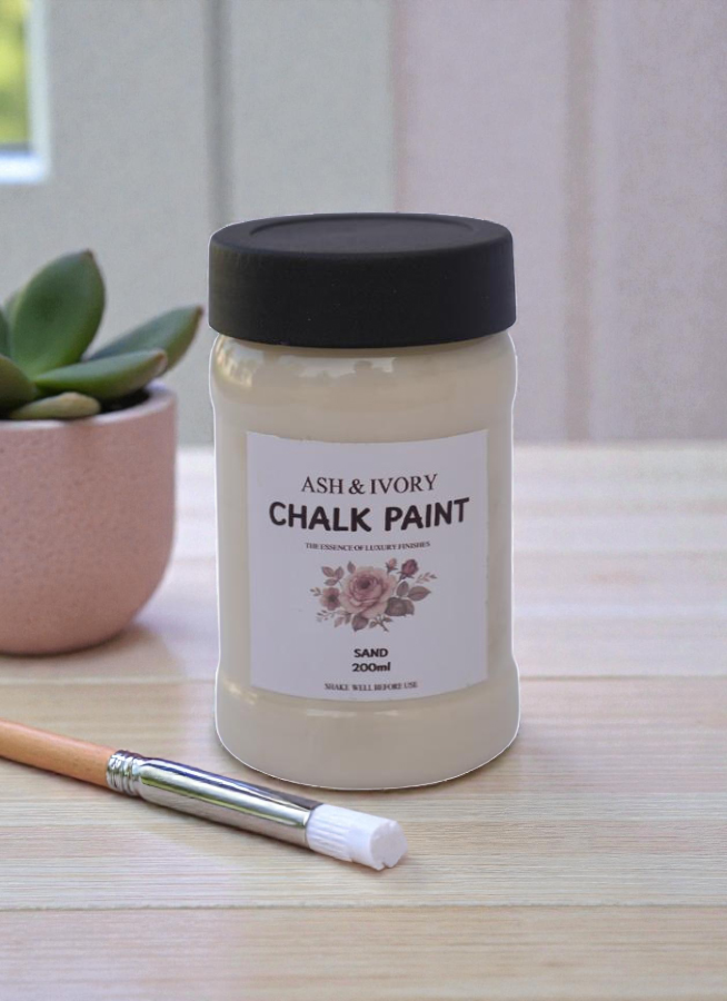 Ash & Ivory Sand Chalk Paint bottle placed on a white wooden table - buy online Pakistan