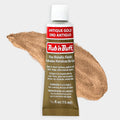 Antique Gold Rub 'n Buff applied to a vintage picture frame next to the tube